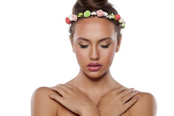 Wall Mural - sensual portrait of a  young woman with a wreath of flowers