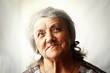 Senior woman portrait on grey background