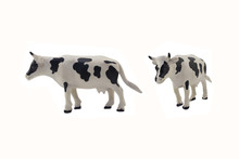 Isolated Cow Toy Photo. Isolated Cow Toy Side And Angle View.