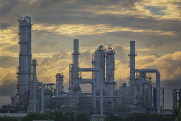 Silhouette of petrochemical plant or Oil and gas refinery in sunrise