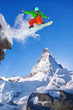 © Tomas Marek - Snowboarder jumping against Matterhorn peak in Switzerland