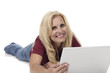 © DW labs Incorporated - Woman Lying on Floor with Laptop Smiling at Camera