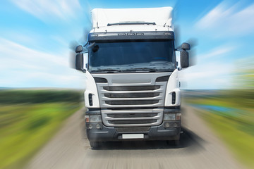 Wall Mural - truck moves on highway in country