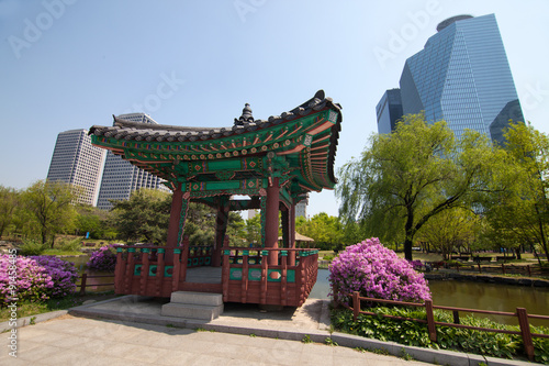 Traditional korean house in park in Seoul Poster