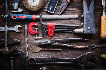 Wall Mural - grungy old tools on a wooden background