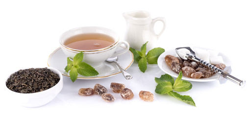 Wall Mural - Composition with a cup of tea and various ingredients