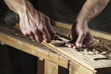 Carpenter Hands Working With A Chisel And Carving Tools