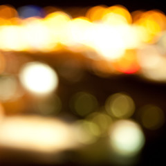 Wall Mural - golden bright lights on dark night background