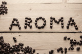Scritta aroma co chicchi di caffè