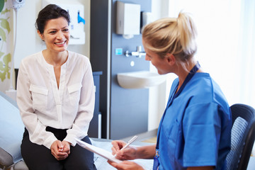 Wall Mural - Female Patient And Doctor Have Consultation In Hospital Room