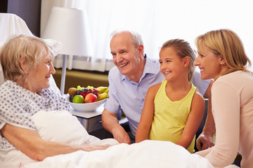 Wall Mural - Family Visit To Grandmother In Hospital Bed