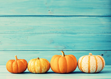 Pumpkins Over Turquoise Wood