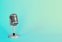 Old Metal Microphone On Turquoise Background