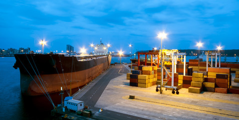 very large ship in the port during cargo operation