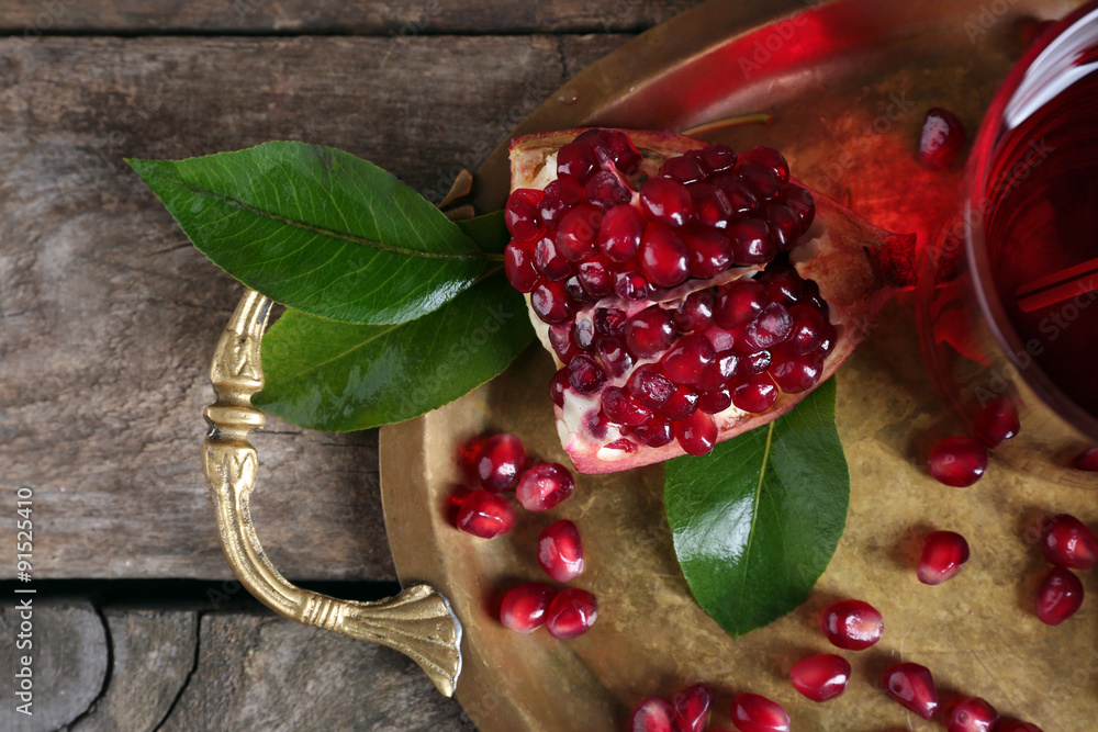 Fresh ripe garnet on wooden table close up