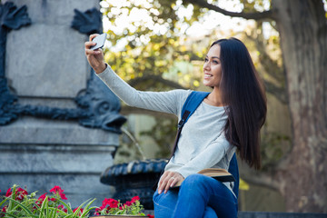 Sticker - Female student making selfie photo on smartphone