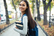 © Drobot Dean - Portrait of a happy female student holding books