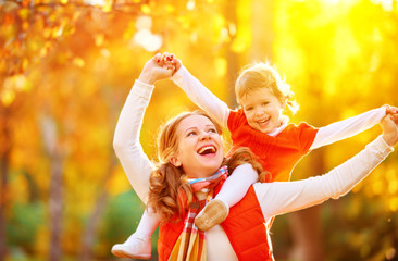 Poster - happy family: mother and child little daughter play cuddling on