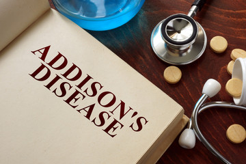 Wall Mural - Addisons disease  written on book with tablets. Medicine concept.