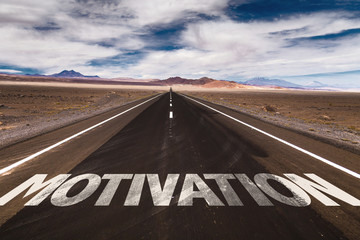 Motivation written on desert road