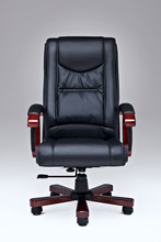 Executive Black Leather Office Chair Over White Ground With Wooden Handles And Legs.