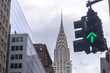 Green street light with Chrysler building in background, NYC