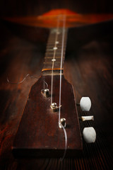 Poster - Folk musical instrument balalaika on wooden background