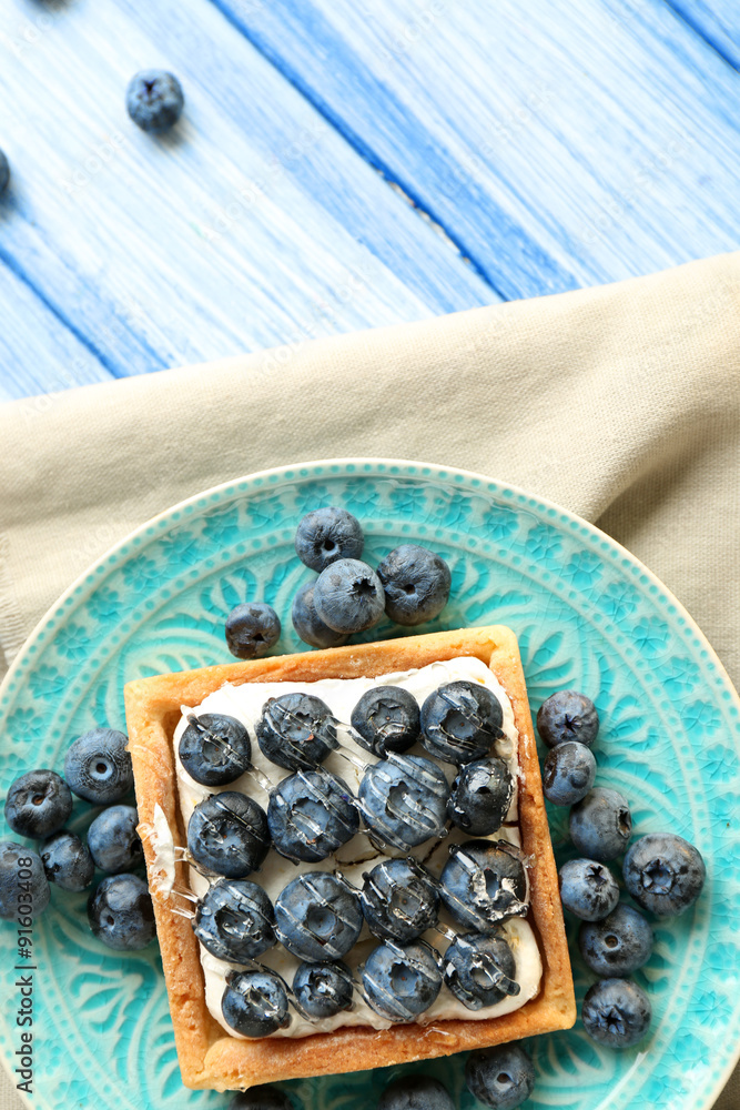 Still life with gourmet fresh blueberry tart