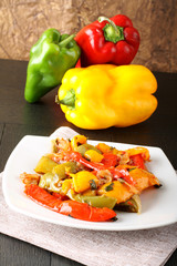 Wall Mural - Peperonata: peppers cut into slices and baked in a pan