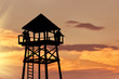 Silhouette of a watchtower with soldiers