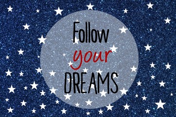 Wall Mural - Follow your dreams motivational message over blue glitter background