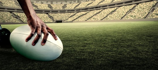 Poster - Composite image of cropped image of athlete holding rugby ball