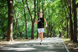 © kurapatka - young caucasian male running in park. Teenager jogging in park