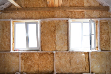 Inside wall heat isolation with mineral wool in wooden house