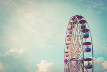Ferris Wheel On Cloudy Sky Background Vintage Color