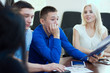 © kanzefar - Young businessman listens attentively to their partners.