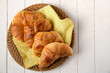 Croissant on yellow napkin