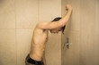 Attractive Young Muscular Man Taking Shower