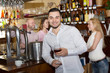 © JackF - Bartender entertaining guests