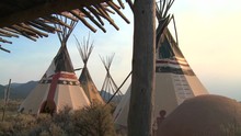 Indian Teepees Stand In A Native American Encampment.