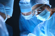 Shot of surgeons working on a patient in an operating room.