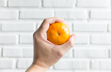 orange in man's hand