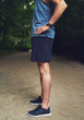 © Flamingo Images - Headless Shot of Athletic Man Standing at the Park