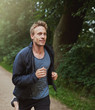 © Flamingo Images - Physical Fit Man Running at the Park Alone