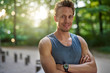 © Flamingo Images - Healthy and Fit Man at the Park Smiles at Camera