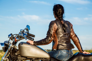 Wall Mural - Biker girl on a motorcycle