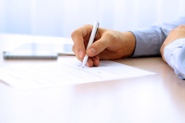 Wall Mural - Businessman is signing a contract, business contract details