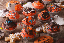 Traditional Halloween Cupcakes And Gingerbread Cookies. Horizontal 
