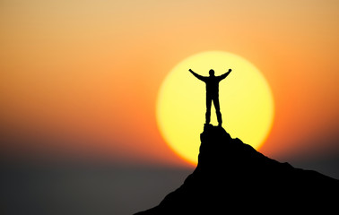 Wall Mural - winner on the mountain top. sport and active life concept..