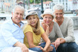 © goodluz - Portrait of cheerful senior people enjoying trip